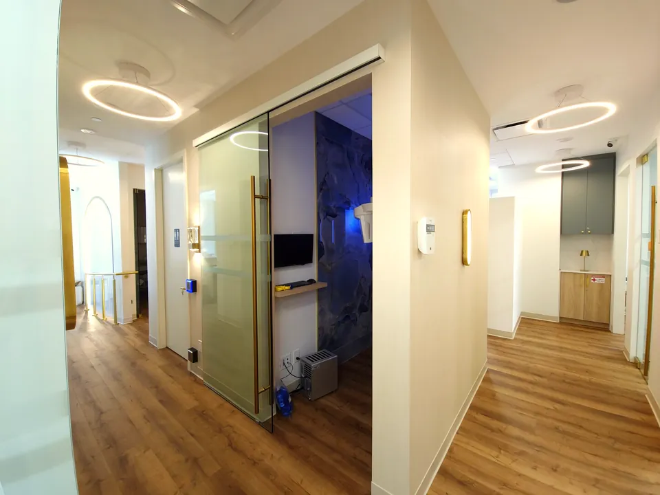 Corridor with halo lighting leading to the imaging suite at Monaco Dentistry